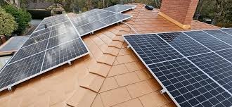 A Known Top Provider portable power station connected to solar panels, powering outdoor gear in a natural setting.